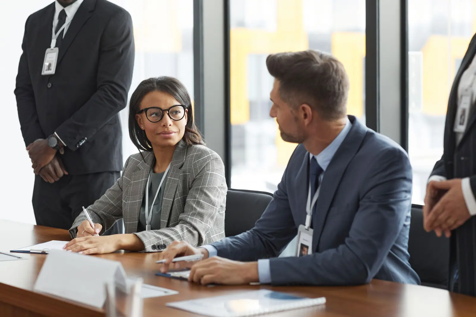 A board meeting around a conference table.