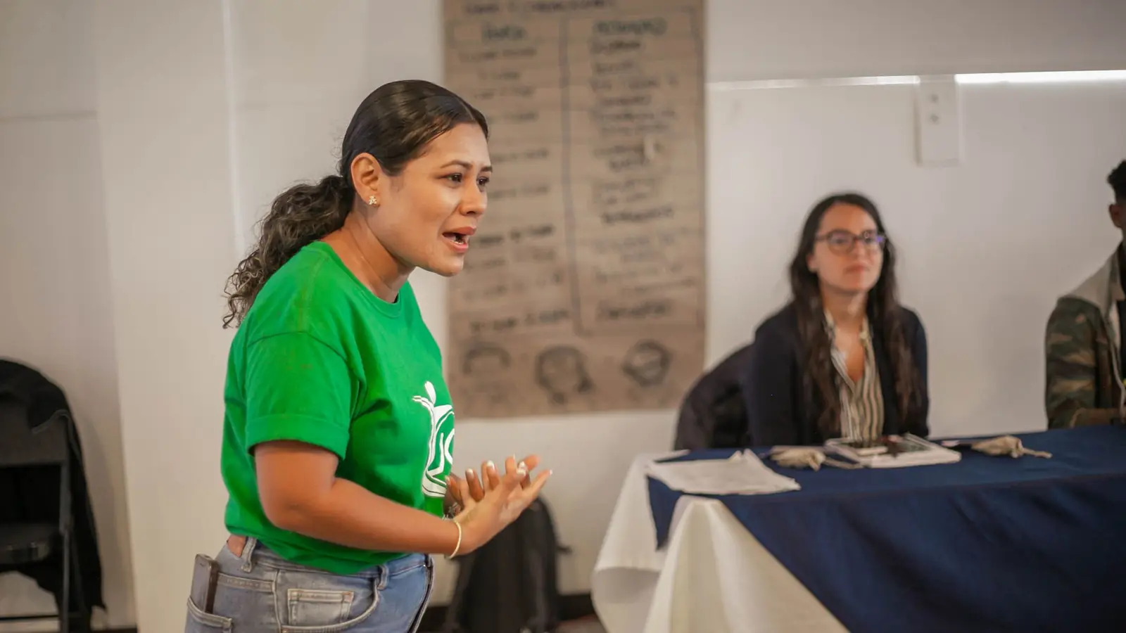 A nonprofit leader speaking with energy during a planning session.
